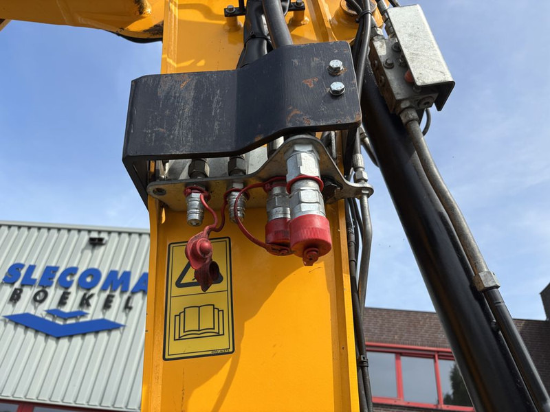 Gumikerekes kotró JCB Hydradig 110W: 14 kép.