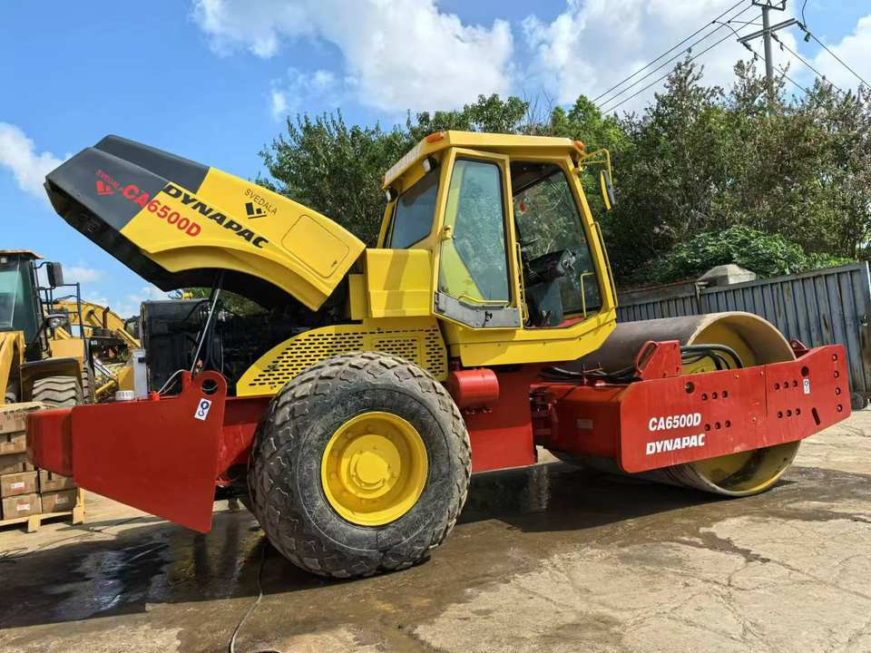 Used Original Road Roller DYNAPAC CA6500D Road Rollers High Quality Second Hand Construction Machinery - Talajtömörítő: 3 kép. Used Original Road Roller DYNAPAC CA6500D Road Rollers High Quality Second Hand Construction Machinery - Talajtömörítő: 3 kép.