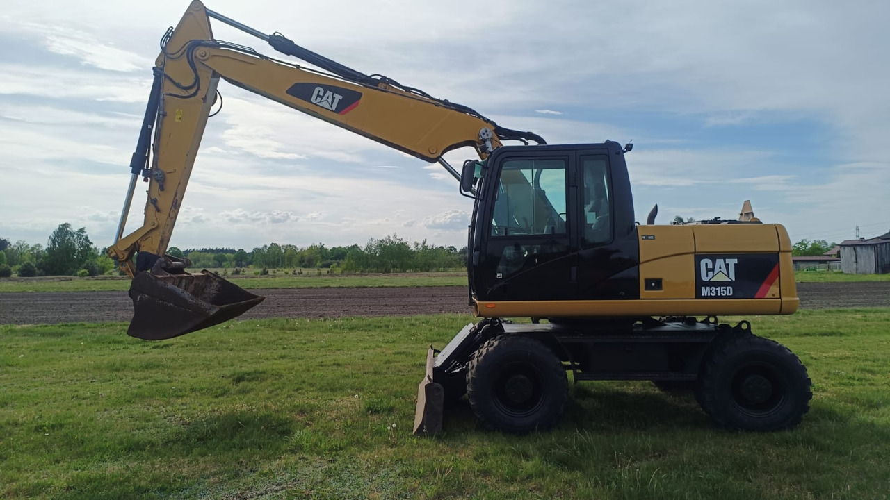 Caterpillar M315D - Lánctalpas kotró: 1 kép. Caterpillar M315D - Lánctalpas kotró: 1 kép.