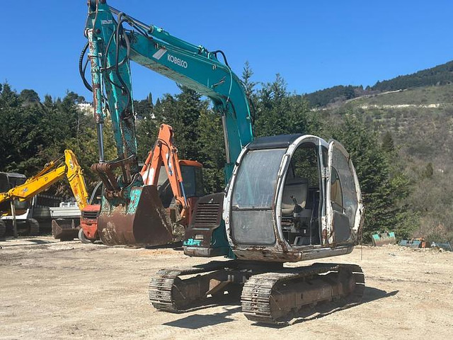 Kobelco SK60 - Kotrógép: 1 kép. Kobelco SK60 - Kotrógép: 1 kép.