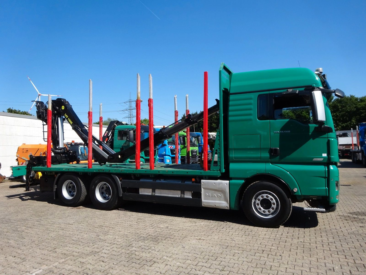 Rönkszállító teherautó, Darus autó MAN 33.560 TGX mit TAJFUN L150Z Holzladekran 6x4: 9 kép.