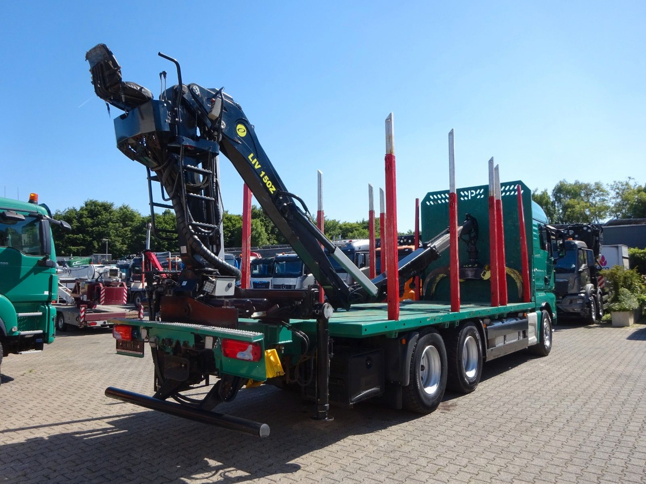 Rönkszállító teherautó, Darus autó MAN 33.560 TGX mit TAJFUN L150Z Holzladekran 6x4: 7 kép.