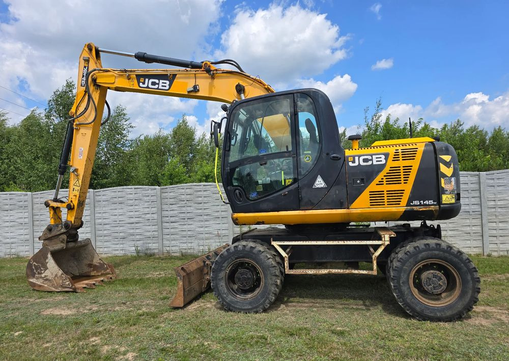 JCB - Gumikerekes kotró: 1 kép. JCB - Gumikerekes kotró: 1 kép.