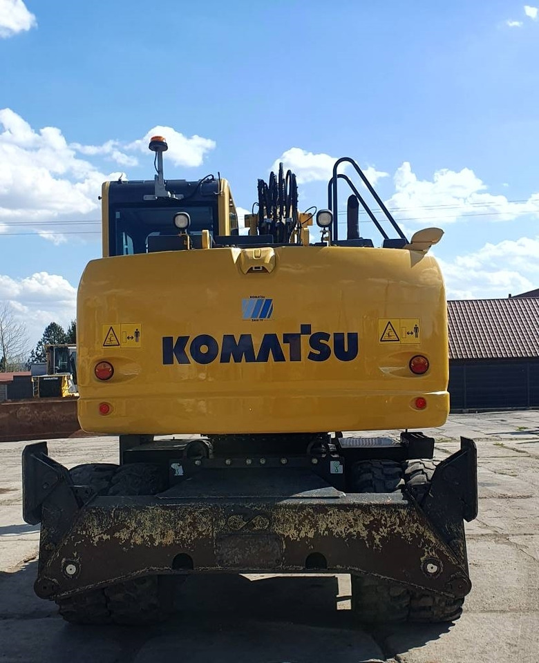 Komatsu PW148-10 - Gumikerekes kotró: 3 kép. Komatsu PW148-10 - Gumikerekes kotró: 3 kép.