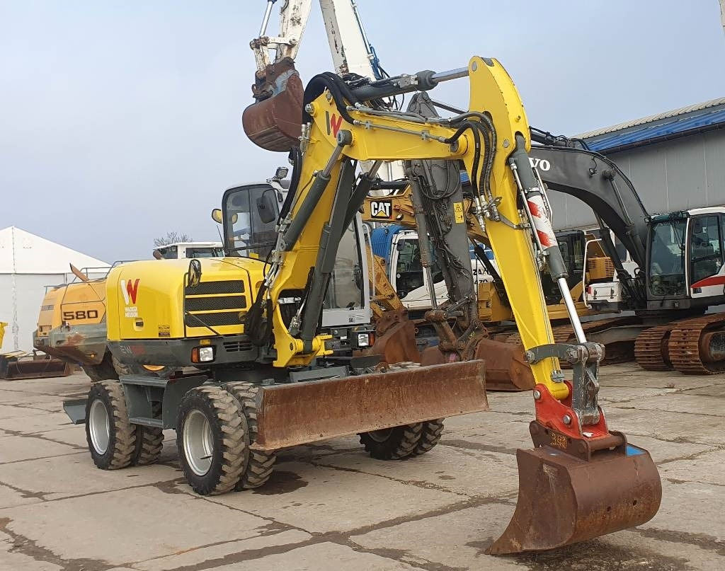 Wacker EW100 - Gumikerekes kotró: 5 kép. Wacker EW100 - Gumikerekes kotró: 5 kép.