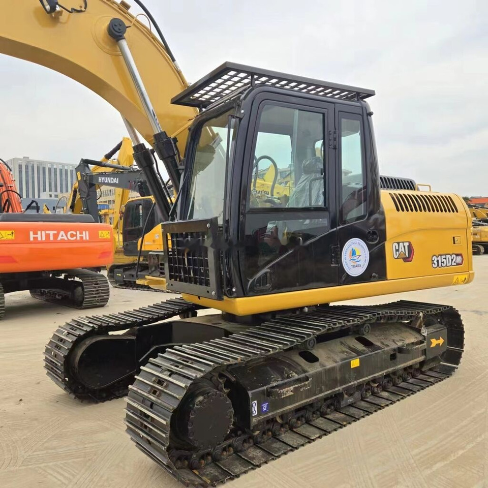 Caterpillar 315D2GC - Lánctalpas kotró: 2 kép. Caterpillar 315D2GC - Lánctalpas kotró: 2 kép.