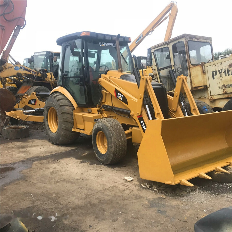 Caterpillar 430F - Kotrórakodó: 1 kép. Caterpillar 430F - Kotrórakodó: 1 kép.