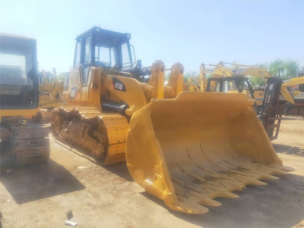 Caterpillar 973 - Lánctalpas homlokrakodó: 5 kép. Caterpillar 973 - Lánctalpas homlokrakodó: 5 kép.