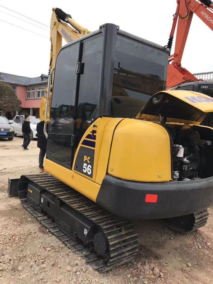 Minikotró Komatsu PC56: 8 kép.