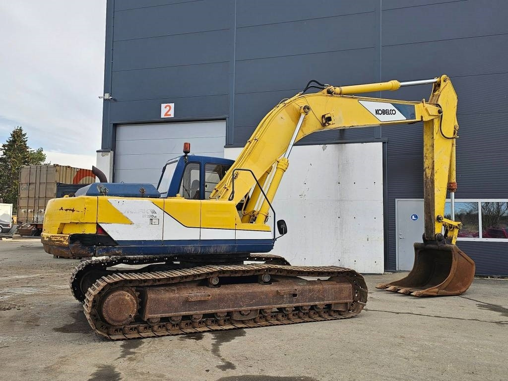 Kobelco SK 220 LC - Lánctalpas kotró: 2 kép. Kobelco SK 220 LC - Lánctalpas kotró: 2 kép.