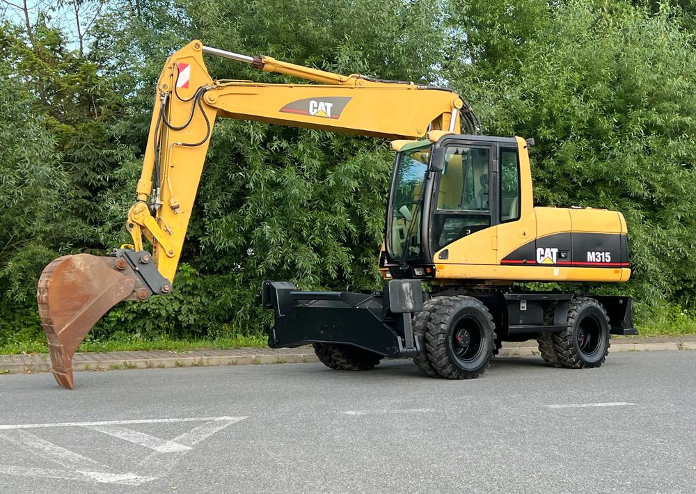 Caterpillar CAT M315C CATERPILLAR SPROWADZONY Bardzo Dobry Stan - Gumikerekes kotró: 2 kép. Caterpillar CAT M315C CATERPILLAR SPROWADZONY Bardzo Dobry Stan - Gumikerekes kotró: 2 kép.