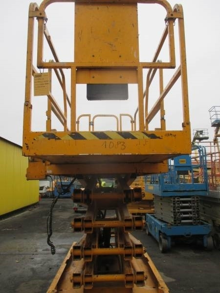Genie GS 3246 - Ollós emelő: 3 kép. Genie GS 3246 - Ollós emelő: 3 kép.