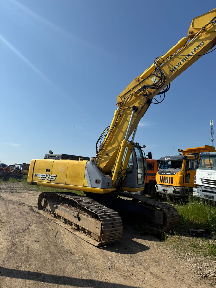 NEW HOLLAND E 215 EXCAVATOR - Lánctalpas kotró: 4 kép. NEW HOLLAND E 215 EXCAVATOR - Lánctalpas kotró: 4 kép.