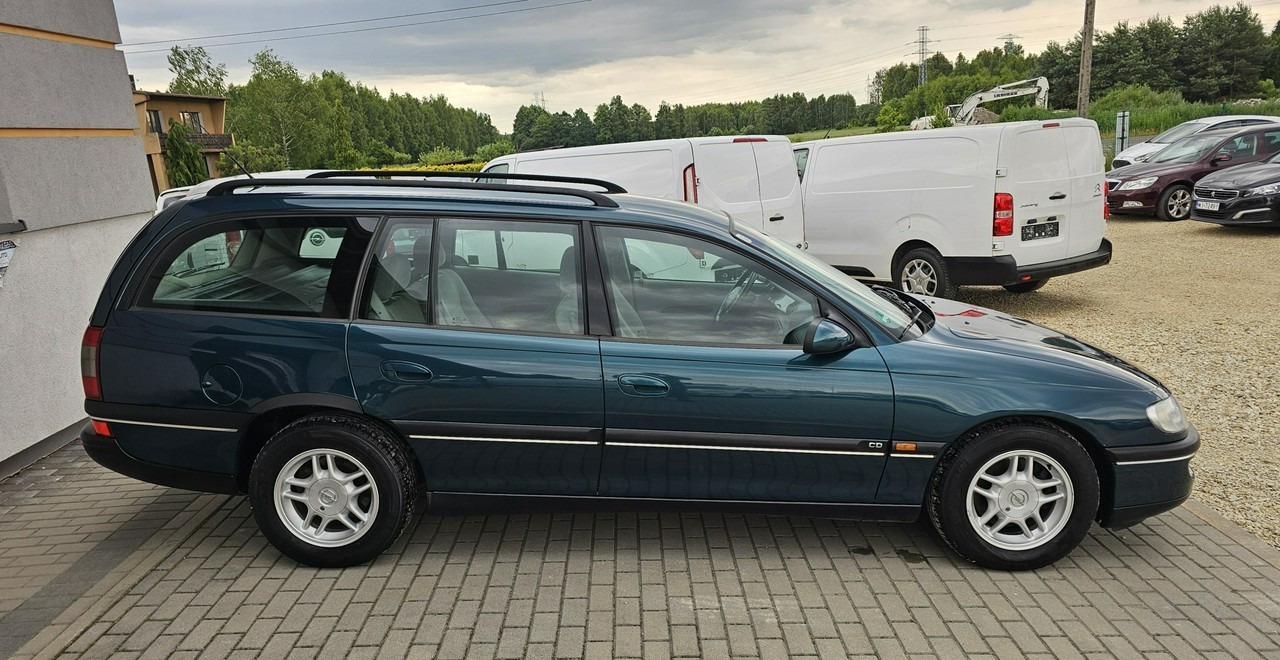 Opel Omega B 2,5 v6 *automat* napęd tył *welury* - Autó: 5 kép. Opel Omega B 2,5 v6 *automat* napęd tył *welury* - Autó: 5 kép.
