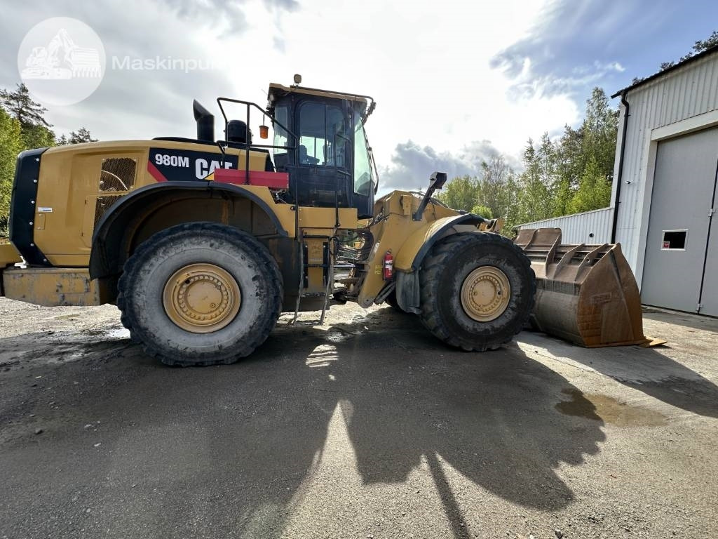 CAT 980 M - Gumikerekes homlokrakodó: 5 kép. CAT 980 M - Gumikerekes homlokrakodó: 5 kép.