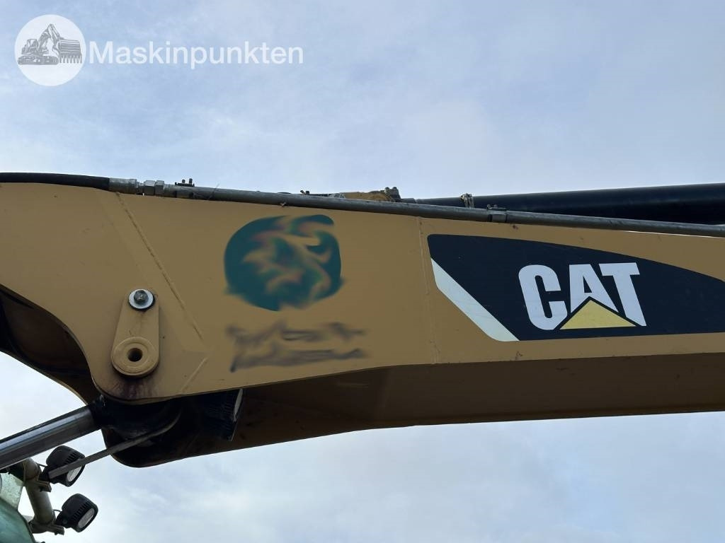 Gumikerekes kotró CAT M 317: 48 kép.