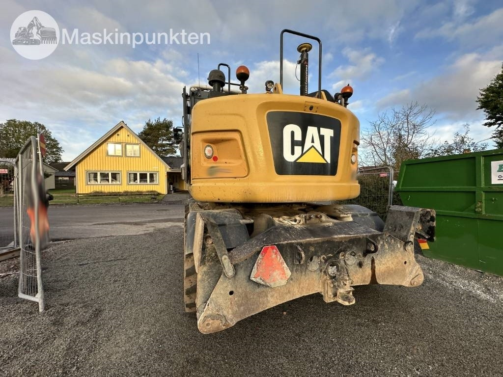 Gumikerekes kotró CAT M 317: 7 kép.
