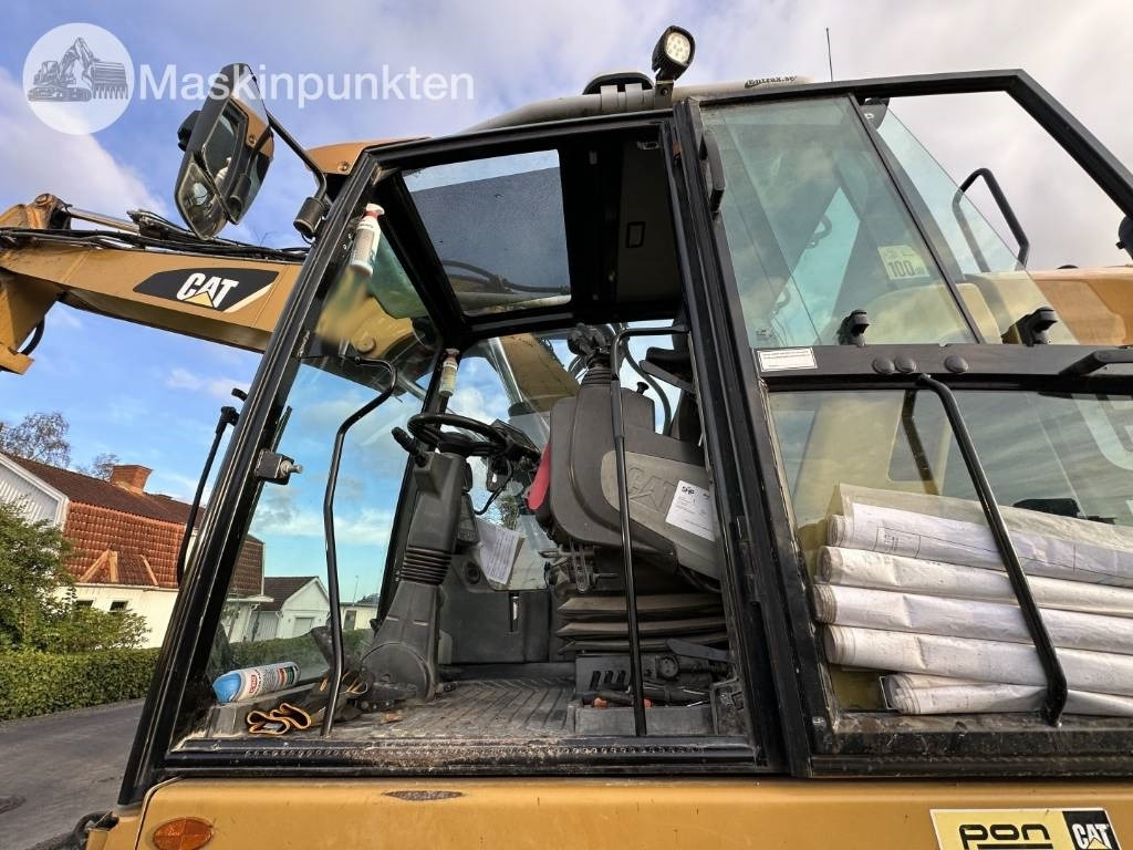 Gumikerekes kotró CAT M 317: 11 kép.