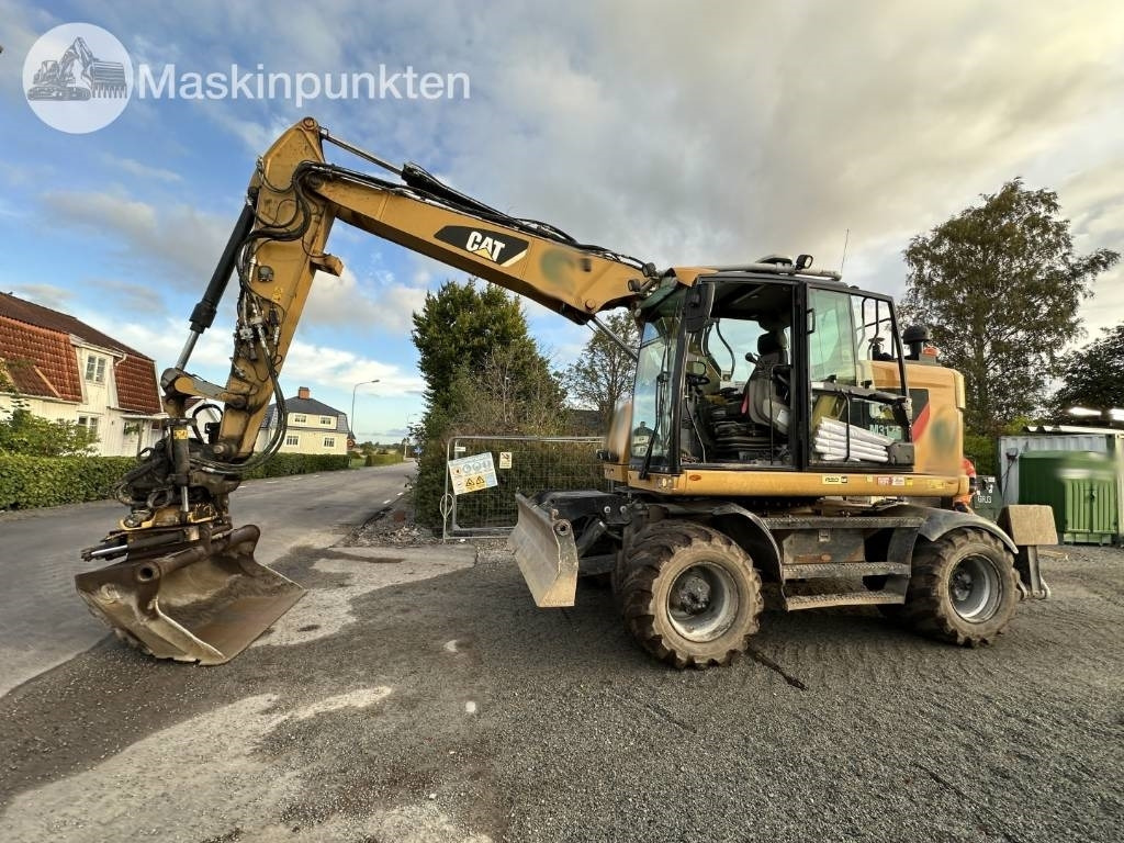Gumikerekes kotró CAT M 317: 9 kép.