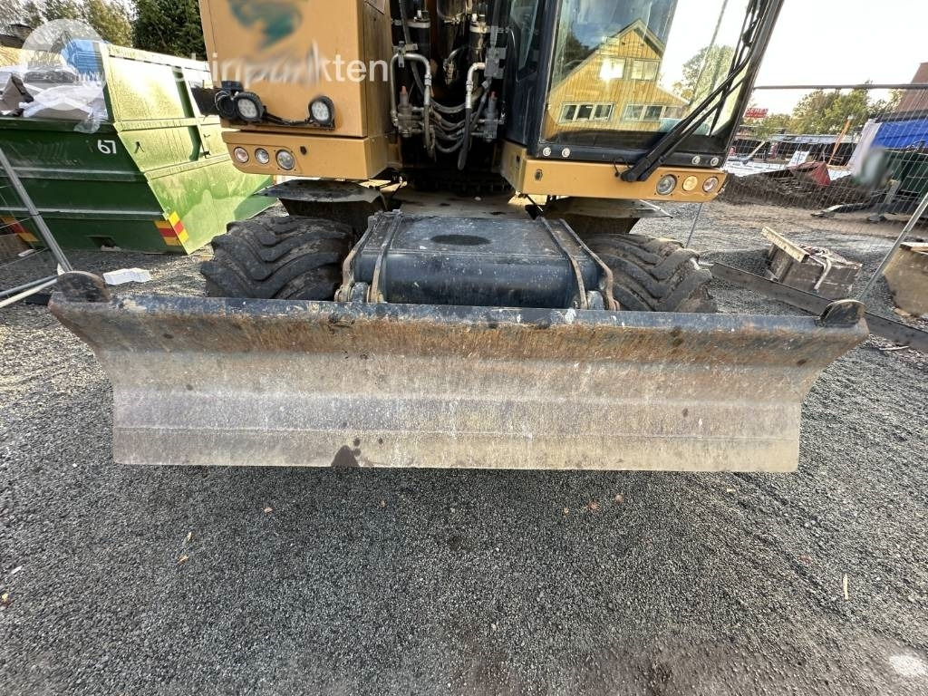 Gumikerekes kotró CAT M 317: 35 kép.