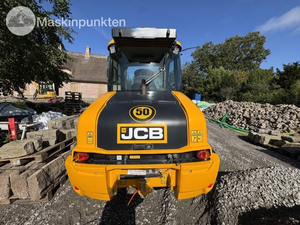 JCB 409 - Gumikerekes homlokrakodó: 3 kép. JCB 409 - Gumikerekes homlokrakodó: 3 kép.