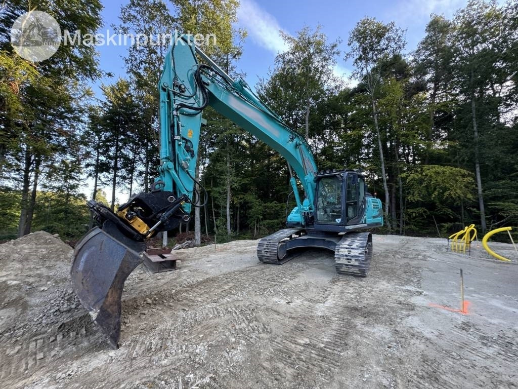 Kobelco SK 210 LC-10 - Lánctalpas kotró: 1 kép. Kobelco SK 210 LC-10 - Lánctalpas kotró: 1 kép.
