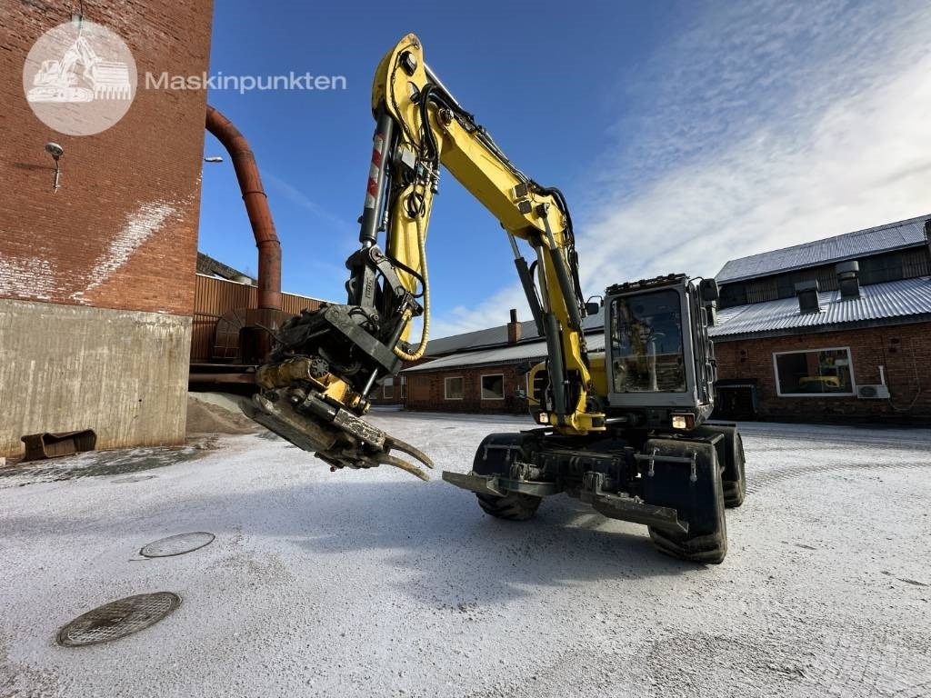 Wacker Neuson EW 100 - Gumikerekes kotró: 2 kép. Wacker Neuson EW 100 - Gumikerekes kotró: 2 kép.