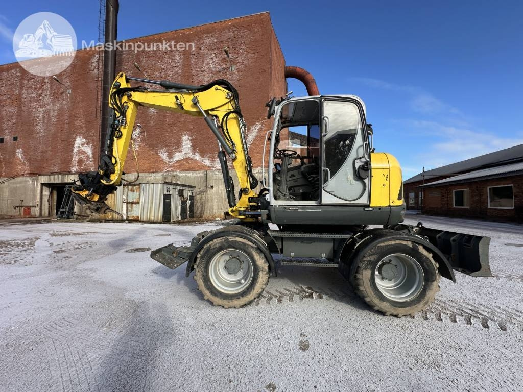 Wacker Neuson EW 100 - Gumikerekes kotró: 1 kép. Wacker Neuson EW 100 - Gumikerekes kotró: 1 kép.