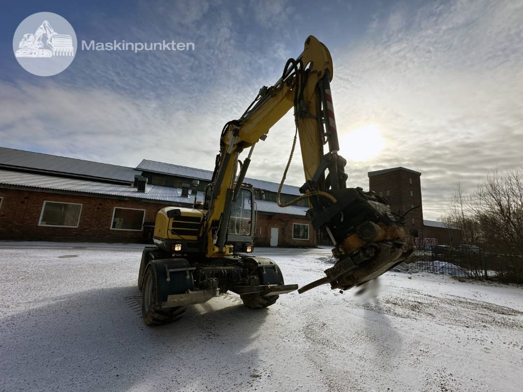 Wacker Neuson EW 100 - Gumikerekes kotró: 4 kép. Wacker Neuson EW 100 - Gumikerekes kotró: 4 kép.