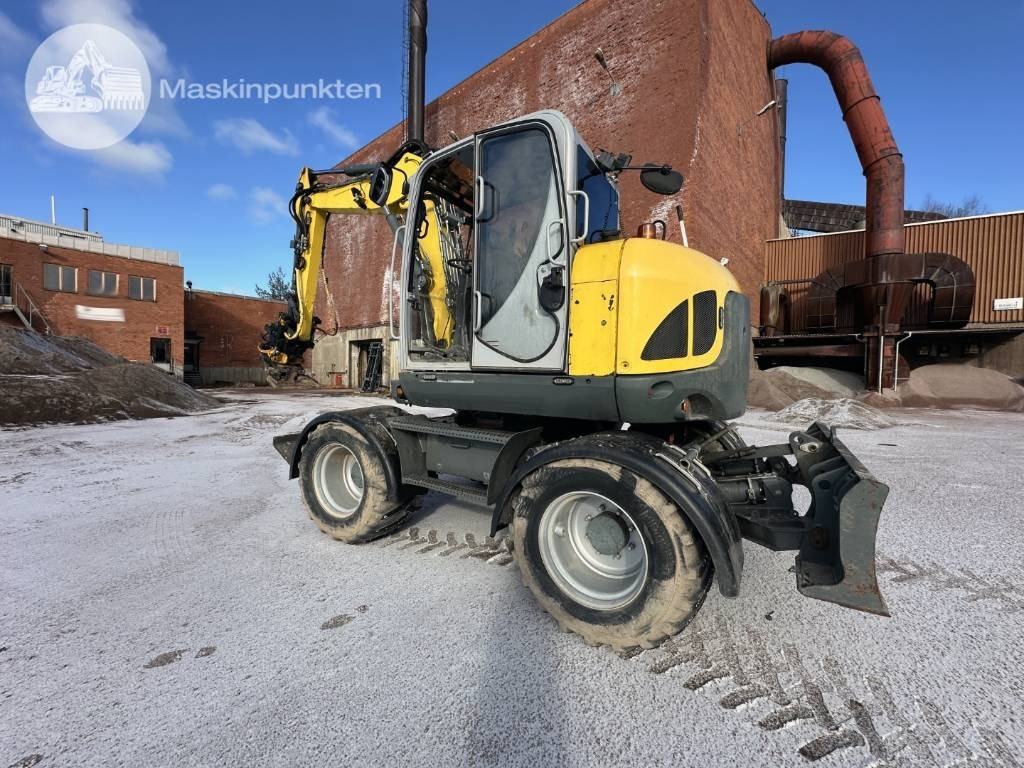 Wacker Neuson EW 100 - Gumikerekes kotró: 4 kép. Wacker Neuson EW 100 - Gumikerekes kotró: 4 kép.