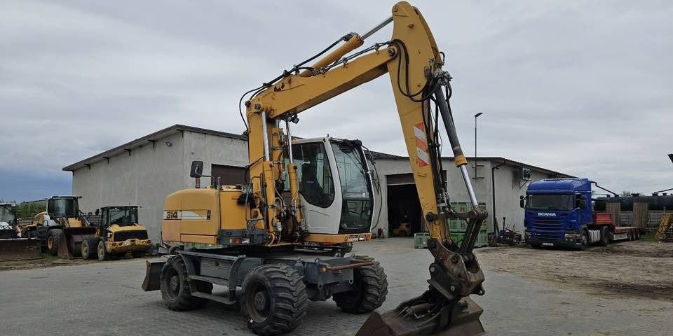 Koparka kołowa Liebherr A314 Litronic 9350 h+ 5 łyżek kołówka - Gumikerekes kotró: 4 kép. Koparka kołowa Liebherr A314 Litronic 9350 h+ 5 łyżek kołówka - Gumikerekes kotró: 4 kép.
