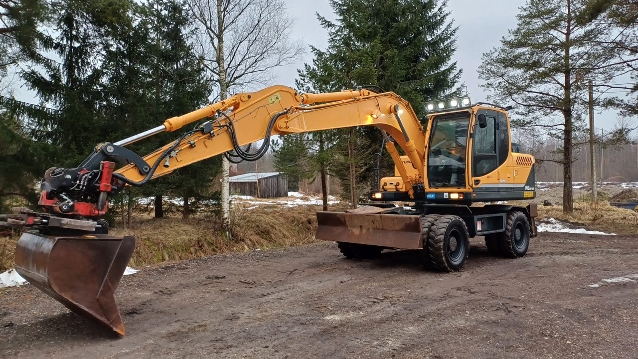 Hyundai Robex 140W-9A - Gumikerekes kotró: 1 kép. Hyundai Robex 140W-9A - Gumikerekes kotró: 1 kép.