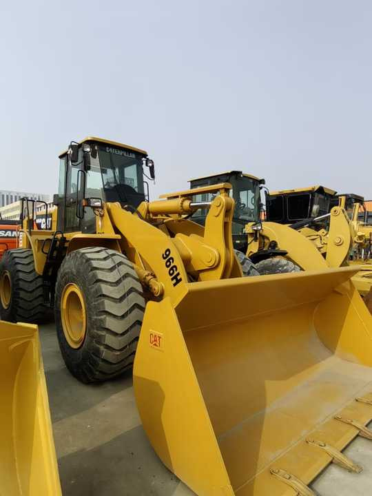 Used CAT 966h Wheel Loader Original Cheap Used Wheel Loader CAT 950 966 Wheel Loaders for Sale - Gumikerekes homlokrakodó: 2 kép. Used CAT 966h Wheel Loader Original Cheap Used Wheel Loader CAT 950 966 Wheel Loaders for Sale - Gumikerekes homlokrakodó: 2 kép.