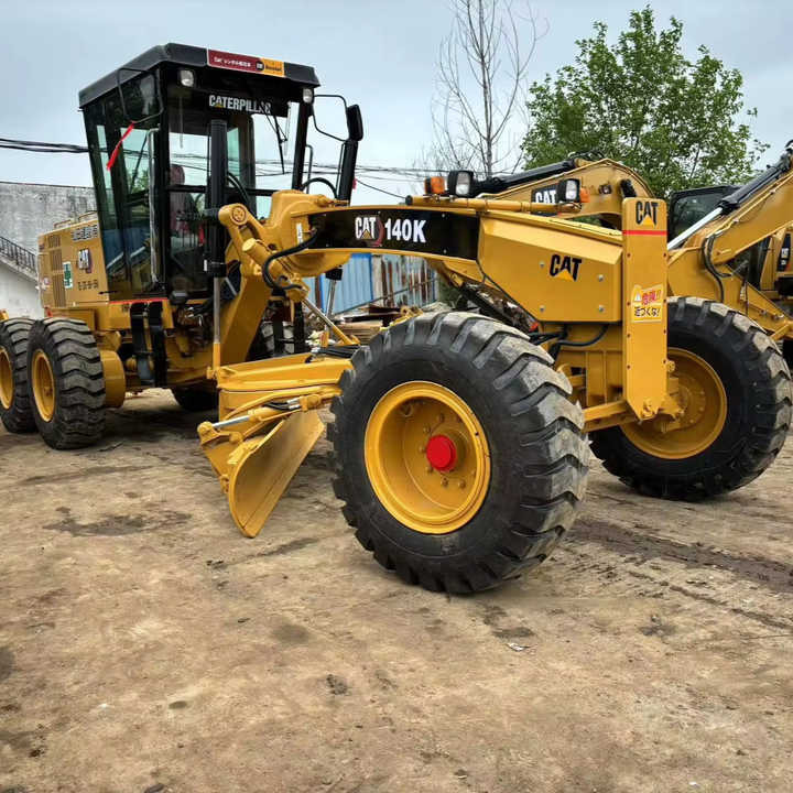 Used Cat 140K New Model Grader Popular Brand Japan Cat Hydraulic Machinery Construction Equipment - Gréder: 1 kép. Used Cat 140K New Model Grader Popular Brand Japan Cat Hydraulic Machinery Construction Equipment - Gréder: 1 kép.