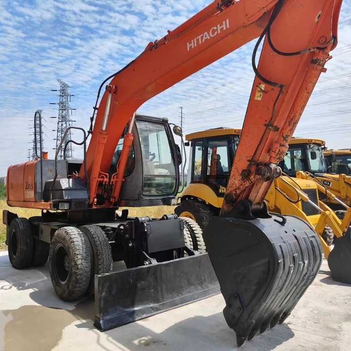Used Japan Original Brand Hitachi Zx 130w Wheel Excavator Hitachi Zx120 130 200 Excavator for Sale - Kotrógép: 2 kép. Used Japan Original Brand Hitachi Zx 130w Wheel Excavator Hitachi Zx120 130 200 Excavator for Sale - Kotrógép: 2 kép.