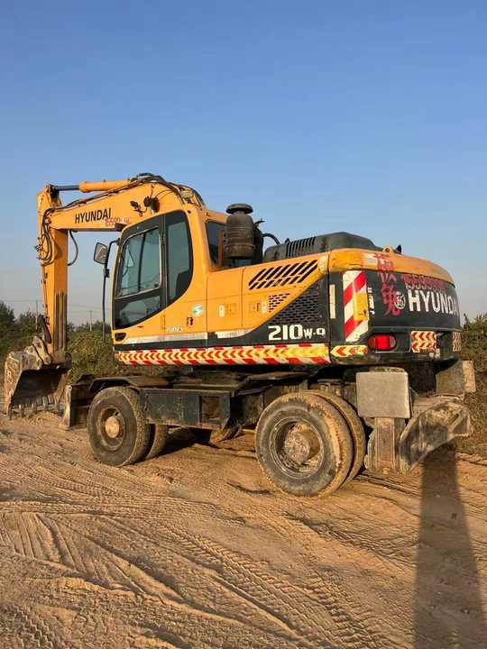 Well-Maintained Hyundai 210-9Used Wheel Excavator Construction Machine | No Major Repairs | Price Negotiable - Gumikerekes kotró: 2 kép. Well-Maintained Hyundai 210-9Used Wheel Excavator Construction Machine | No Major Repairs | Price Negotiable - Gumikerekes kotró: 2 kép.