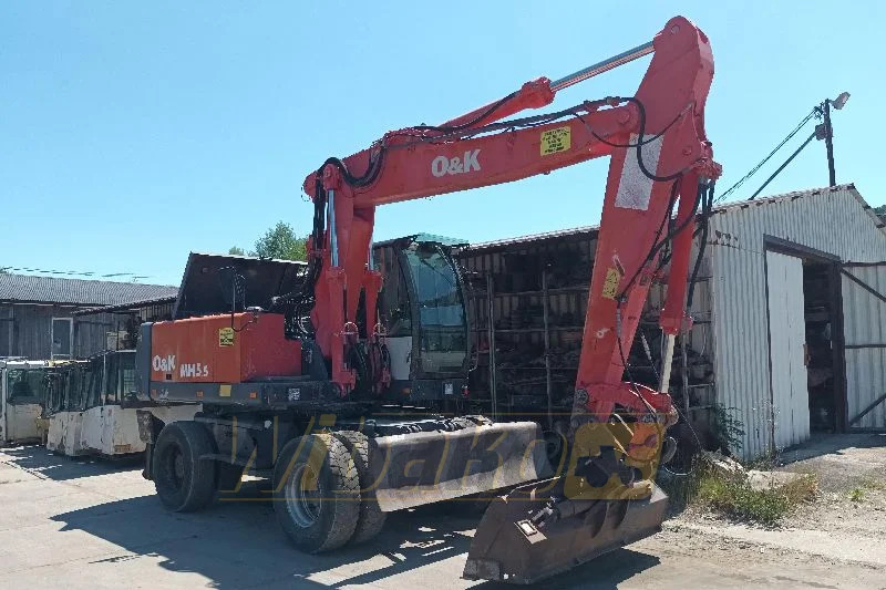O&K MH5.5 - Gumikerekes kotró: 1 kép. O&K MH5.5 - Gumikerekes kotró: 1 kép.