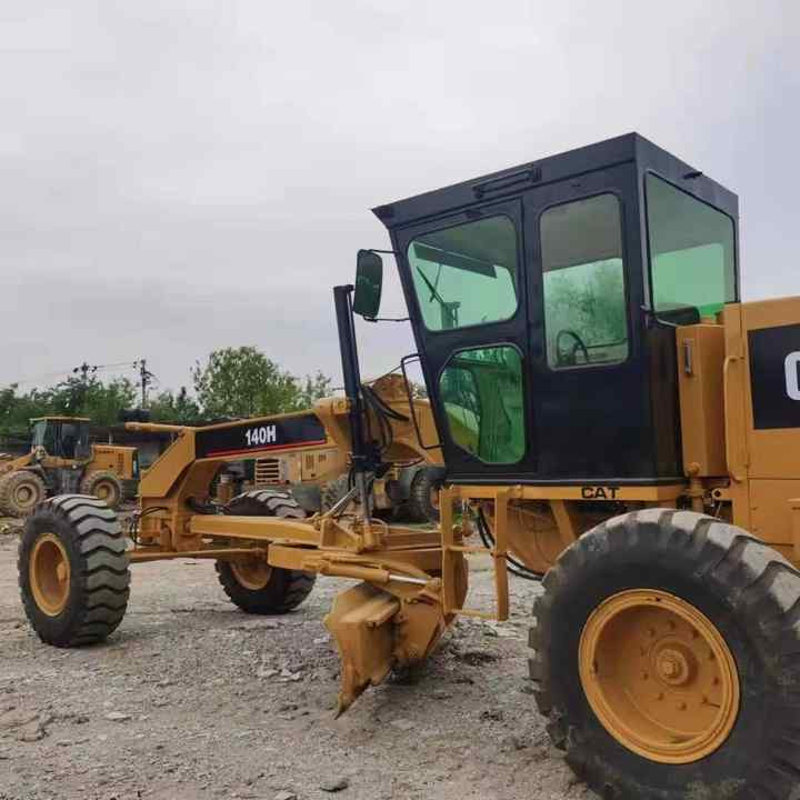 Used Caterpillar CAT 140H Land Road Motor Grader CAT140 CAT140H Used Grader Cheap Price for Sale - Gréder: 3 kép. Used Caterpillar CAT 140H Land Road Motor Grader CAT140 CAT140H Used Grader Cheap Price for Sale - Gréder: 3 kép.