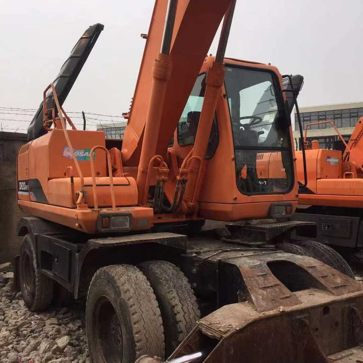 Used Digger Doosan Dh210w-7 Construction Machinery Construction Digger Used Doosan Dh210w-7 Cheap Excavator - Gumikerekes kotró: 3 kép. Used Digger Doosan Dh210w-7 Construction Machinery Construction Digger Used Doosan Dh210w-7 Cheap Excavator - Gumikerekes kotró: 3 kép.