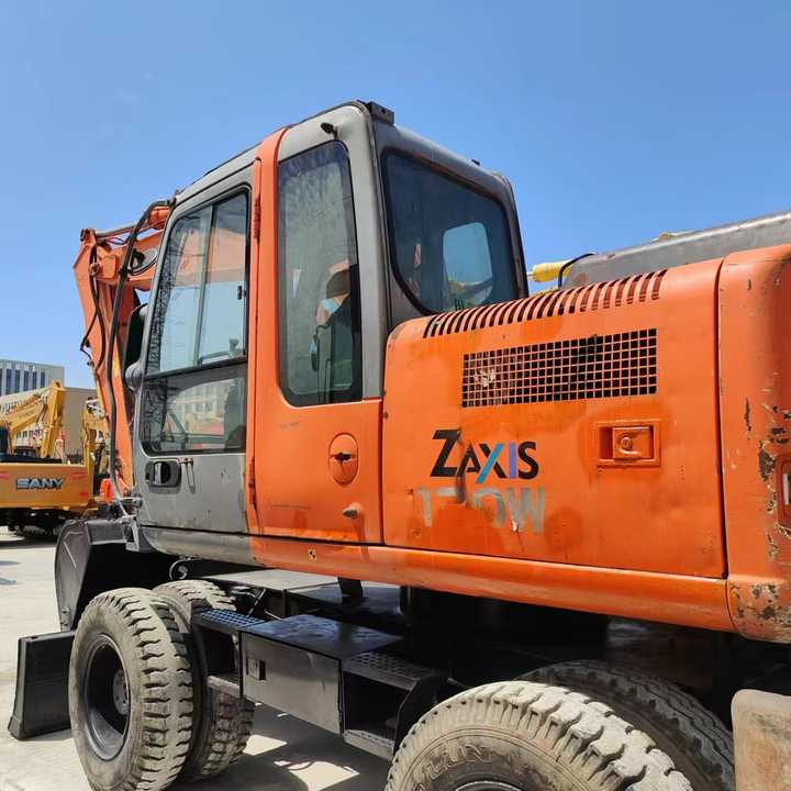 Used Japan Original Brand Hitachi Zx 130w Wheel Excavator Hitachi Zx120 130 200 Excavator for Sale - Gumikerekes kotró: 3 kép. Used Japan Original Brand Hitachi Zx 130w Wheel Excavator Hitachi Zx120 130 200 Excavator for Sale - Gumikerekes kotró: 3 kép.