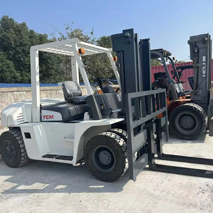 High Quality TCM 7 Ton with Hydraulic Distance Adjustment Used Forklift in Stock Used tcm Forklift 7 Ton Used tcm Fd70 Forklift - Villás targonca: 1 kép. High Quality TCM 7 Ton with Hydraulic Distance Adjustment Used Forklift in Stock Used tcm Forklift 7 Ton Used tcm Fd70 Forklift - Villás targonca: 1 kép.