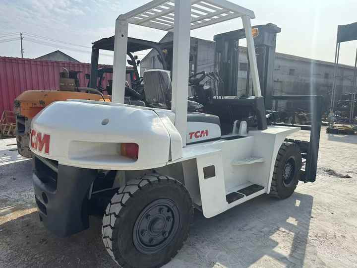 High Quality TCM 7 Ton with Hydraulic Distance Adjustment Used Forklift in Stock Used tcm Forklift 7 Ton Used tcm Fd70 Forklift - Villás targonca: 2 kép. High Quality TCM 7 Ton with Hydraulic Distance Adjustment Used Forklift in Stock Used tcm Forklift 7 Ton Used tcm Fd70 Forklift - Villás targonca: 2 kép.