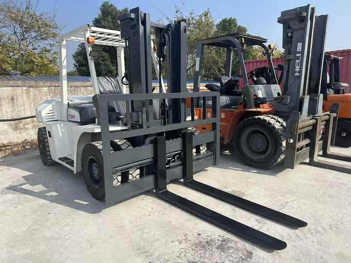 High Quality TCM 7 Ton with Hydraulic Distance Adjustment Used Forklift in Stock Used tcm Forklift 7 Ton Used tcm Fd70 Forklift - Villás targonca: 3 kép. High Quality TCM 7 Ton with Hydraulic Distance Adjustment Used Forklift in Stock Used tcm Forklift 7 Ton Used tcm Fd70 Forklift - Villás targonca: 3 kép.