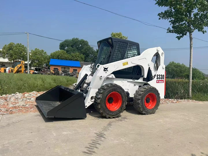 The Best Selling Used Construction Machinery in USA Bobcat S330 Loader High Quality and Cheap Price - Mini homlokrakodó: 2 kép. The Best Selling Used Construction Machinery in USA Bobcat S330 Loader High Quality and Cheap Price - Mini homlokrakodó: 2 kép.