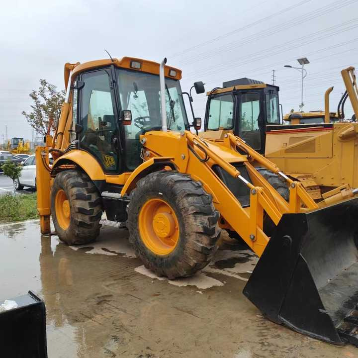 Used Backhoe Loader JCB 4x4 Wheel 20 Ton Backhoe Loader JCB 3CX 4CX Backhoe Excavator Loader Fpr Sale - Kotrórakodó: 3 kép. Used Backhoe Loader JCB 4x4 Wheel 20 Ton Backhoe Loader JCB 3CX 4CX Backhoe Excavator Loader Fpr Sale - Kotrórakodó: 3 kép.