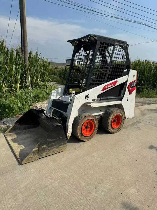 Used Bobcat S70 Skid Teer in Stock Good Condition bobcat S70 S160 185 300 330 Skid Steer for Sale - Mini homlokrakodó: 2 kép. Used Bobcat S70 Skid Teer in Stock Good Condition bobcat S70 S160 185 300 330 Skid Steer for Sale - Mini homlokrakodó: 2 kép.