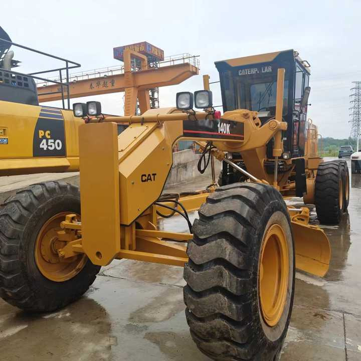 Used Cat 140K New Model Grader Popular Brand Japan Cat Hydraulic Machinery Construction Equipment - Gréder: 1 kép. Used Cat 140K New Model Grader Popular Brand Japan Cat Hydraulic Machinery Construction Equipment - Gréder: 1 kép.
