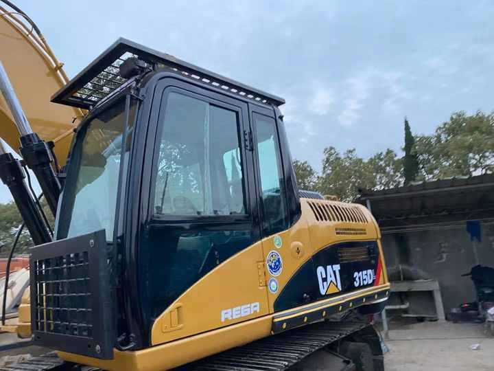 Used Crawler Caterpillar 315DL Excavator with Good Performance Hot Sale Used Engineering & Construction Machinery - Kotrógép: 3 kép. Used Crawler Caterpillar 315DL Excavator with Good Performance Hot Sale Used Engineering & Construction Machinery - Kotrógép: 3 kép.