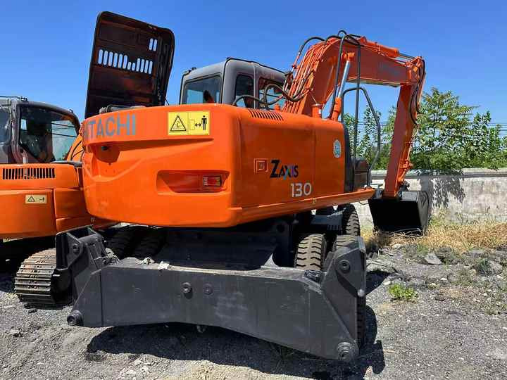 Used Wheel Excavator Hitachi ZX 130W Made in Japan 13tonHitachi Zx130w Wheel Excavator Price Used Hitachi Zx130 Excavator SALE - Kotrógép: 2 kép. Used Wheel Excavator Hitachi ZX 130W Made in Japan 13tonHitachi Zx130w Wheel Excavator Price Used Hitachi Zx130 Excavator SALE - Kotrógép: 2 kép.