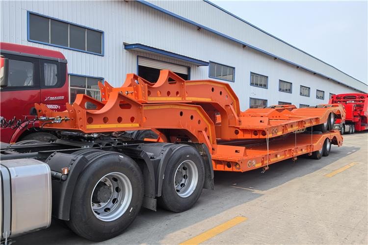 TITAN 2 Axle Low Low Bed Trailer for Sale In Angola - Félpótkocsi mélybölcsős: 1 kép. TITAN 2 Axle Low Low Bed Trailer for Sale In Angola - Félpótkocsi mélybölcsős: 1 kép.